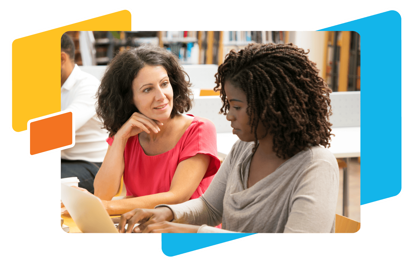 Two women seated at a table engage in a lively conversation. One is using a laptop, likely discussing innovative teaching practices. Bookshelves filled with resources for empowering students are visible in the background, perhaps hinting at their dedication to star awards in education.